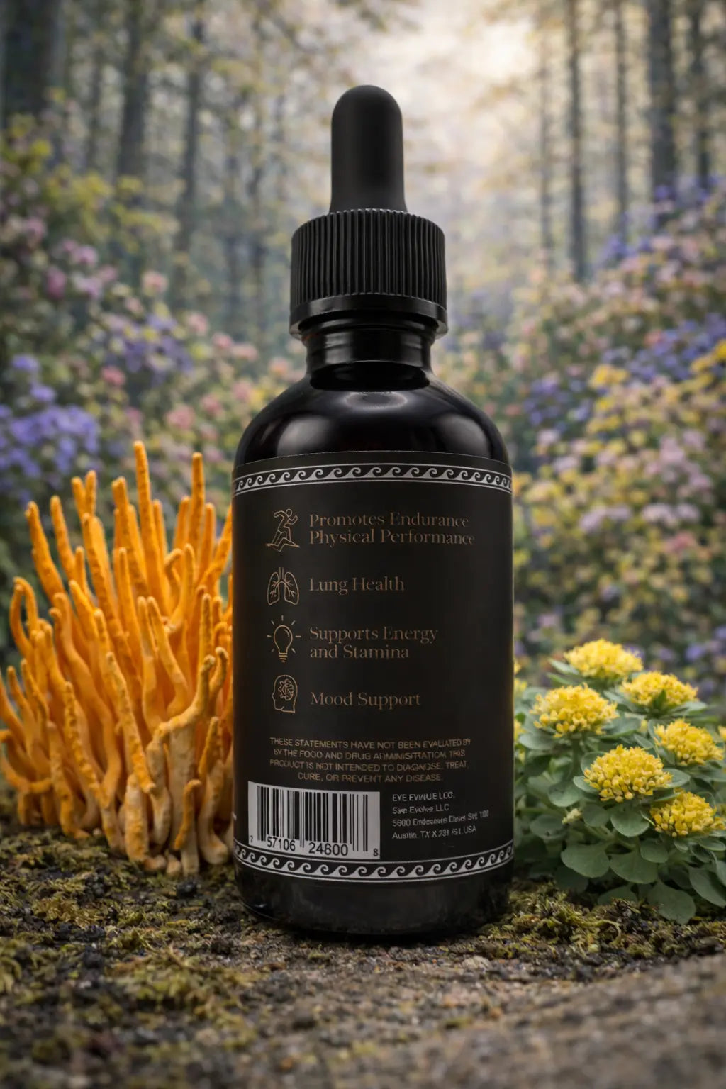 Black tincture bottle with dropper against a natural background with plants and flowers.